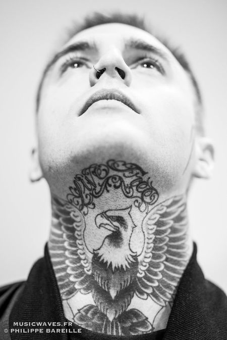 johnny looking up showing his tattoos 